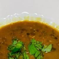 Dal Makhani · Black lentils with kidney beans cooked with ginger, garlic and spices.