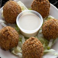 Falafel · Falafel; is a deep-fried ball or patty-shaped fritter made from ground chickpeas.