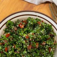Tabbouleh · Tabbouleh is a Levantine salad made mostly of finely chopped parsley, with tomatoes, mint, o...