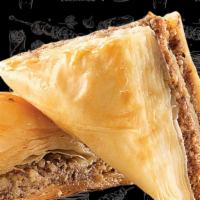 Baklava · layered pastry dessert made of filo pastry filled with chopped nuts, sweetened with syrup or...