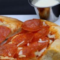 Pepperonio Pizza · Hand tossed homemade pizza dough topped with our own homemade marinara sauce, Italian Pepper...