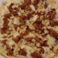 Bbq Pulled Pork Pizza · Hand tossed homemade pizza dough topped with tangy BBQ sauce, grilled onions, slow cooked pu...