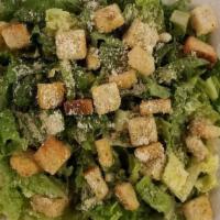 Caesar Salad · Garden Fresh Romaine lettuce tossed with Caesar dressing croutons and parmesan cheese