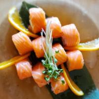 Butterfly Kisses · Crab salad wrapped in fresh salmon with sweet ponzu and soy mustard dressing, no rice.