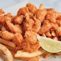 Popcorn Shrimp · Petite shrimp tossed in a crispy batter. A very fun way to crunch down your shrimps served w...