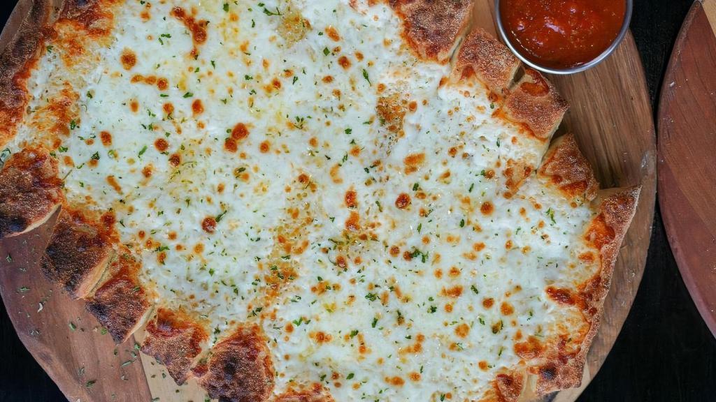 Cheesy Breadsticks · Handcrafted using our fresh baked dough, sliced into approx 10 pcs, topped with whole-milk mozzarella, served with house marinara