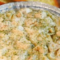 Chicken Fettuccine Alfredo · Fettuccine tossed in our creamy house alfredo, topped with grilled chicken, sprinkled with a...
