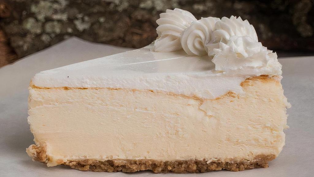 Ny Style Cheesecake · Smooth and creamy classic New York style cheesecake, topped with a hint of light whipped cream