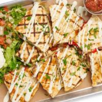 Beef Fajita Quesadilla · Filled with Peppers, Onions, Jack Cheese. Served with Cilantro Lime Crema and Cilantro
