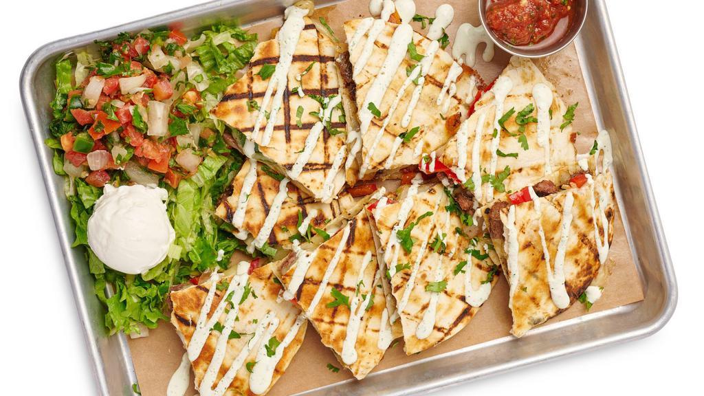 Beef Fajita Quesadilla · Filled with Peppers, Onions, Jack Cheese. Served with Cilantro Lime Crema and Cilantro