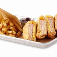 Monte Cristo Sandwich · Turkey, Ham, Swiss and American Cheese, battered and fried, topped with Powered Sugar and se...