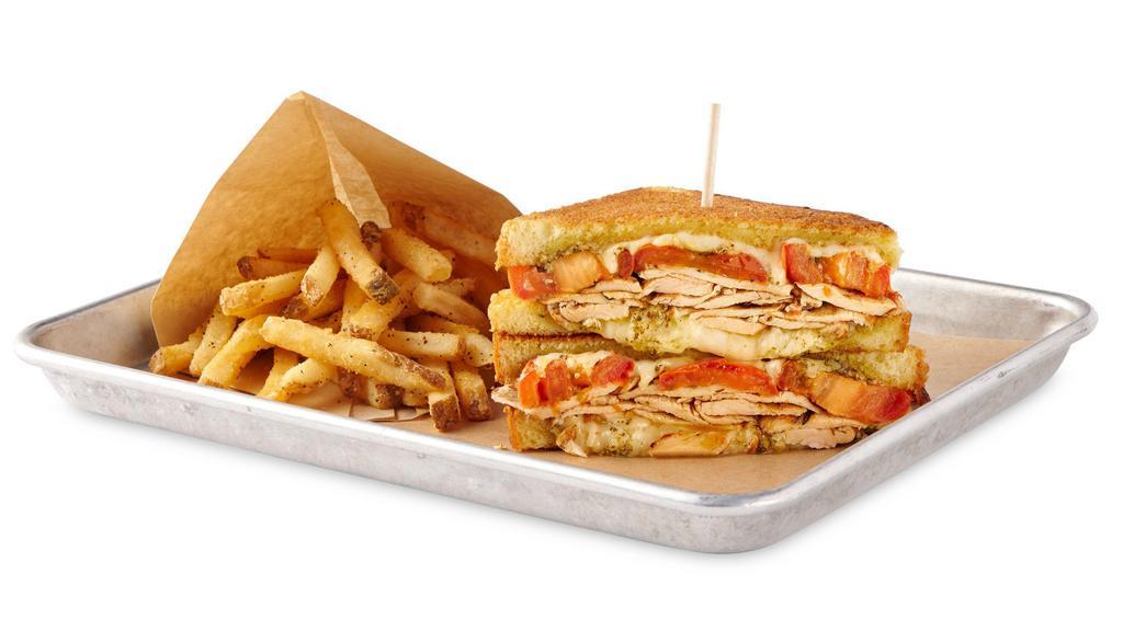 Pesto Chicken Melt · Grilled Chicken, Herb Roasted Tomatoes, Pesto Sauce with Fontina and Jack Cheese on toasted brioche bread
