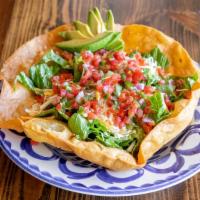Taco Salad · Crispy taco bowl, tomatoes, avocado, salsa, cilantro, jalapeno-lime dressing, mexi-queso, ro...