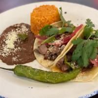 Pork Tacos · ancho skirt steak, pickled red onion, roasted poblano, chile de árbol, cheese