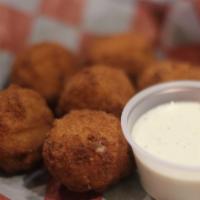 Cowboy Bites · Fried Cheese Bites with Bacon and Corn. Served with Ranch
