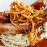 Bangers & Mash · Two grilled bratwursts, Parsley mashed potatoes, dark gravy, and fried onions.