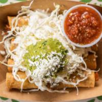Flautas (Black Bean) · 4 flautas filled with refried black beans, topped with cabbage, guacamole, queso fresco, cre...