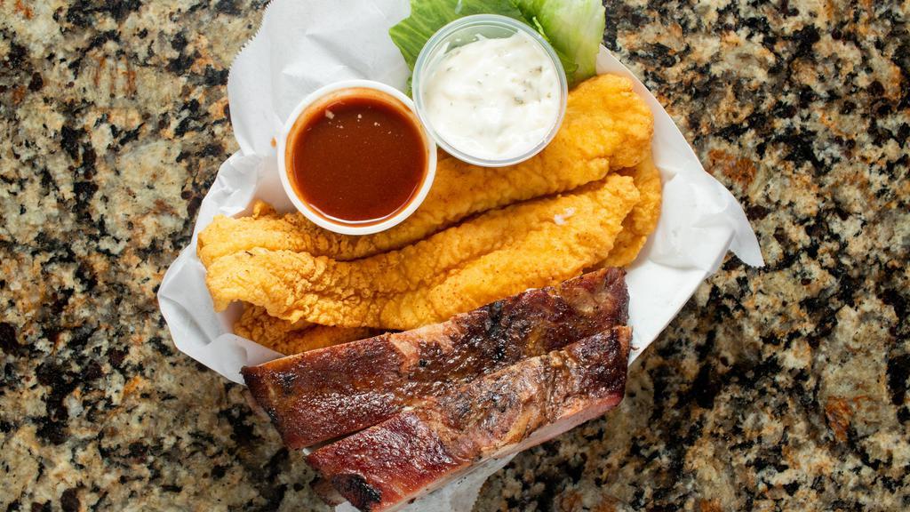 Toe Cee Deaux · Texas Surf and Turf 1 Golden fried piece of Fish and one rib served with 1 side of your choice.