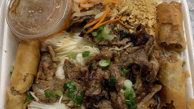 Lemongrass Beef Stir-Fry On Vermicelli / Bun Bo Xao · Lemongrass beef stir-fry on top of vermicelli bowls filled with fresh herbs, shredded lettuce, cucumber, pickled carrots, and crushed peanuts. Served with a side of house sauce with chili and pickled carrot.