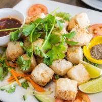 Shaken Tofu / Tau Hu Luc Lac · Vegetarian. Cubes of soft tofu lightly battered in garlic spices and tossed over high flame....