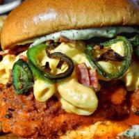 Buffalo Mac N' Chickn · Our spicy project piled high with mac n' cheese, bacon, and grilled jalapeño