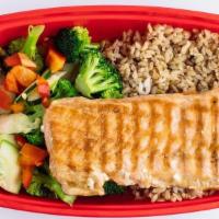 Mega Omega · A 6 ounce portion of grilled salmon served. with brown rice, broccoli snap peas, red. pepper...