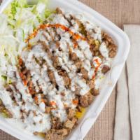 Lamb Over Rice · Lamb/Beef over rice topped with  house special white sauce and Hot sauce.