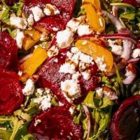 Beauty And The Beets · Fresh arugula topped with feta, roasted beets, pecan, red onion and dried turkish apricots, ...