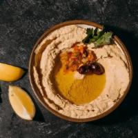 Hummus · A smooth thick mixture of mashed chickpeas, sesame paste, extra virgin olive oil, fresh lemo...