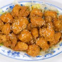 Sesame Chicken · Hot & spicy. Lightly battered chicken fried slightly, tossed in a tangy sauce and topped wit...