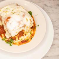 Lasagna · Layers of beef, homemade marinara sauce, cheeses and spices, topped off with melted mozzarel...