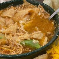 Tortilla Soup · Homemade chicken tortilla soup, freshly made, topped with cheese and tostadas, served with p...