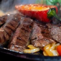 Beef Fajitas · Top-quality outside skirt steak, marinated and charbroiled. Served on a sizzling platter wit...