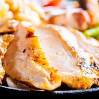 Chicken Fajitas · Marinated chicken breast, charbroiled to perfection. Served on a sizzling platter with grill...