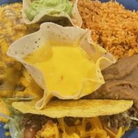 Combinacion De Res · One beef enchilada, topped with chili con carne and melted cheese, and a crispy beef taco wi...