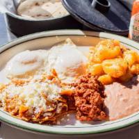 Super Breakfast · Two eggs, chilaquiles and chorizo. Served with beans and potatoes.