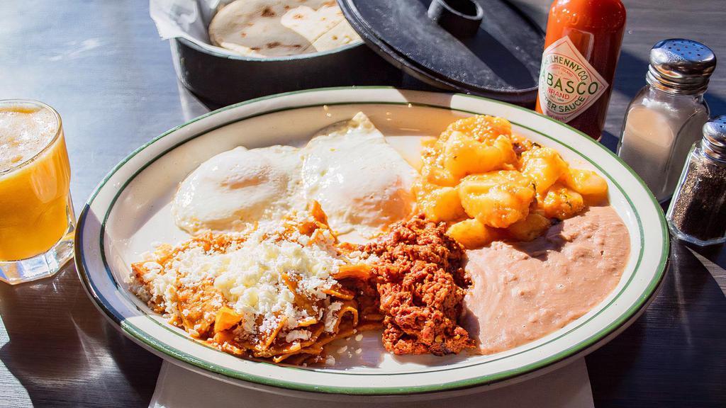 Super Breakfast · Two eggs, chilaquiles and chorizo. Served with beans and potatoes.