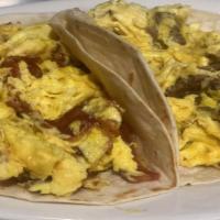 Breakfast Tacos · A warm flour tortilla filled with your choice of filling.