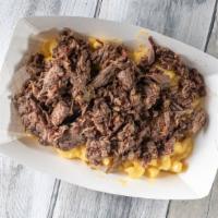 Stoner Mac · Cheesy seasoned mac and cheese topped with a 1/4 lb smoked chopped brisket.