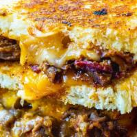Brisket Grilled Cheese Combo · 1/4 lb of smoked sliced brisket in cheese, pepper jack or cheddar cheese, and sweet sourdoug...