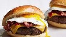 Fried Egg Bacon Cheeseburger · 1/2 lb beef patty, crispy bacon, fried egg, cheese of your choice, served on a sweet- sourdo...