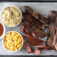 Hungry Man'S Combo · 1/4 LB of brisket, sausage, and pork ribs. Choice of two Sides and served with a sweet tea.