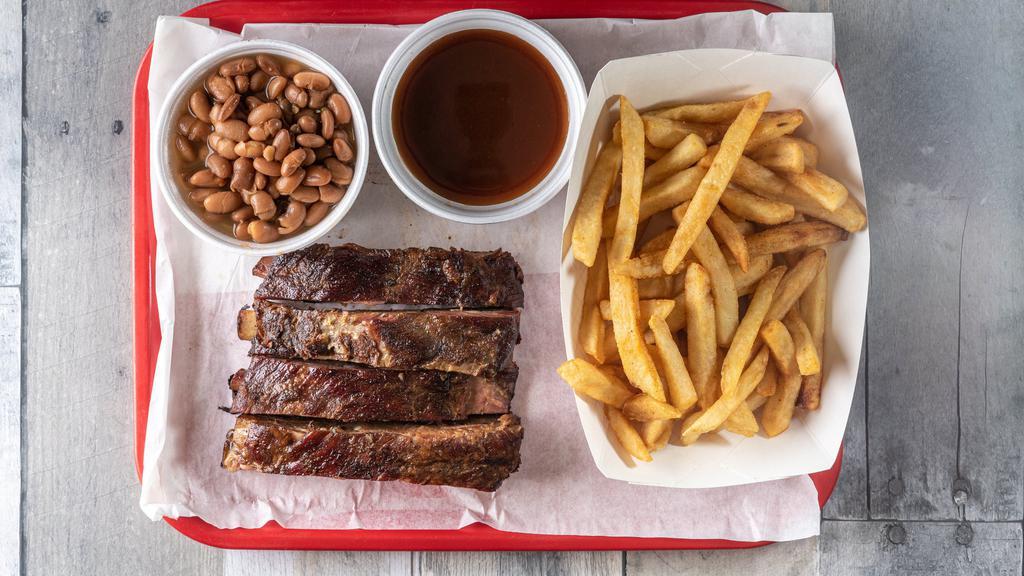 Pork Rib Plate · 1/2 LB of pork ribs, includes two sides. drink not included.