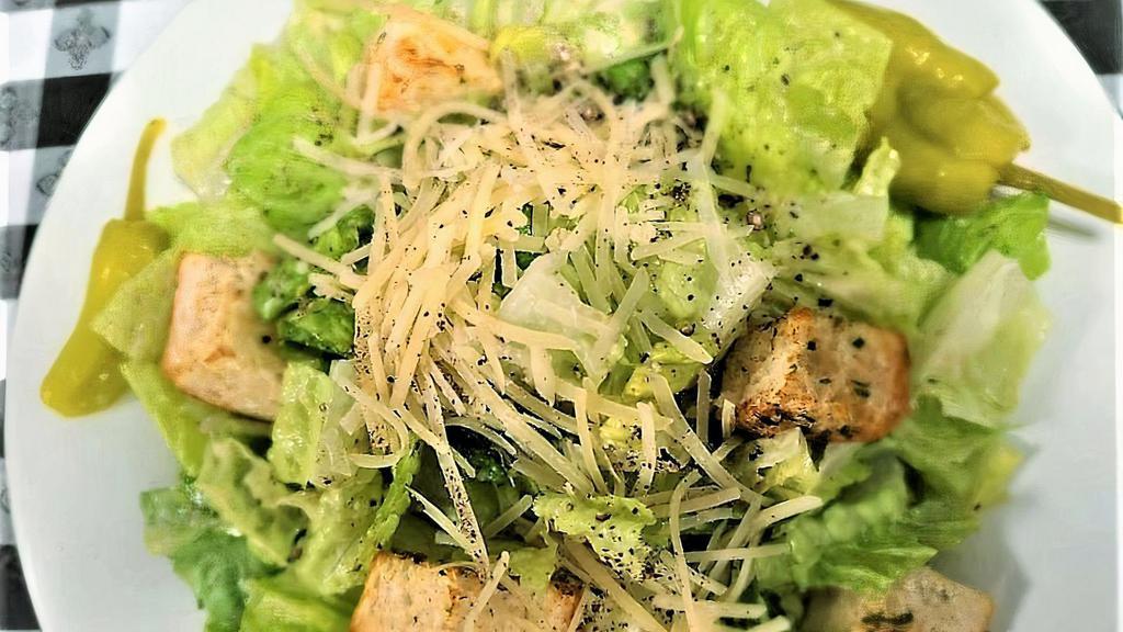 Caesar Salad · Scratch-made dressing with anchovy, lemon, and garlic tossed with crisp romaine lettuce, fresh crunchy croutons, and parmesan cheese.