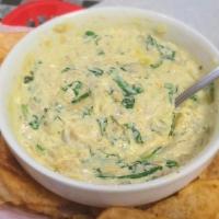 Spinach Artichoke Dip · Artichoke hearts, fresh garlic, wilted spinach, and a blend of fine Italian cheeses melted t...