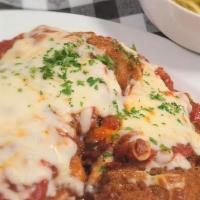 Chicken Parmesan · Lightly breaded chicken cutlets topped with marinara sauce, parmesan, and mozzarella cheeses...