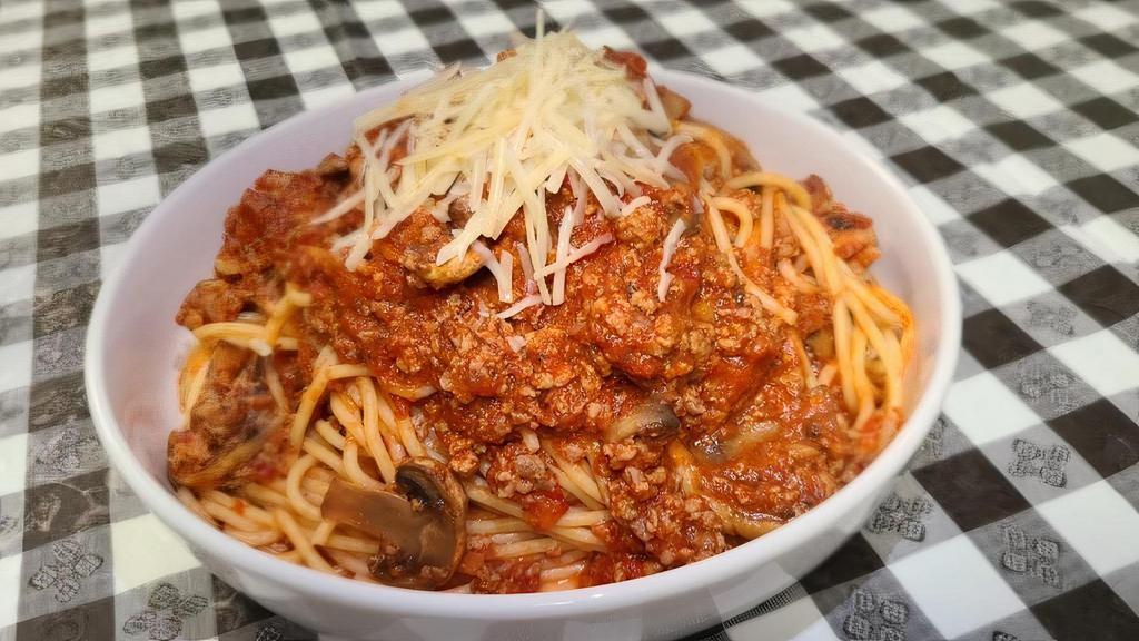 Spaghetti Bolognese · Slow simmered meat sauce and fresh mushrooms tossed with spaghetti.