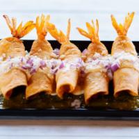 Taquitos De Camaron · Five crispy shrimp taquitos served on a bed of tomatillo sauce then topped with a delicious ...