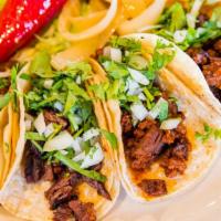 Street Tacos · Four small corn tortilla tacos with your choice of carnitas, brisket, ground beef or rancher...