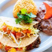Crispy Tacos · Three crispy tacos with ground beef or chicken ranchero served with rice and refried beans.
